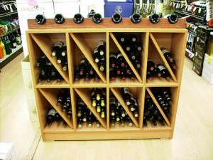 Use custom made wine and liquor store fixtures to make a category destination for wine and liquor connoisseurs.